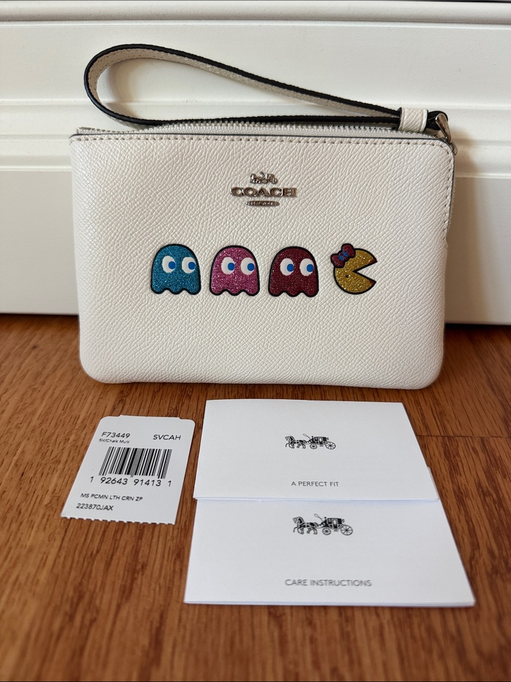 Coach White Wristlet with Colorful Pac-Man Characters